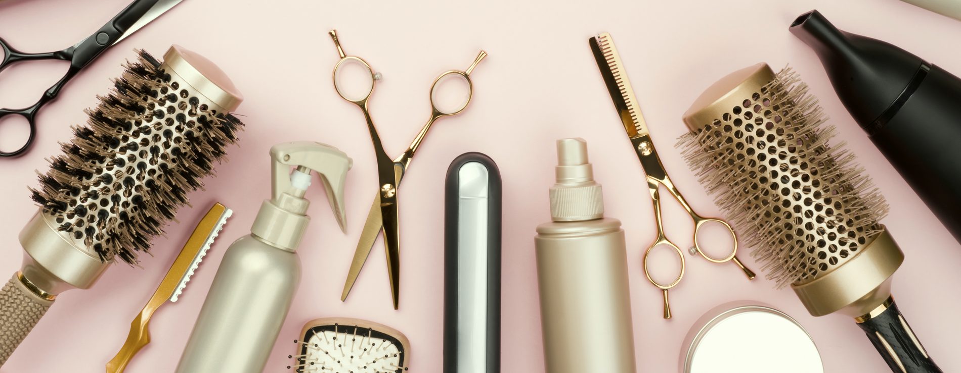 Brushes, shears, combs and styling products laid out at the studio